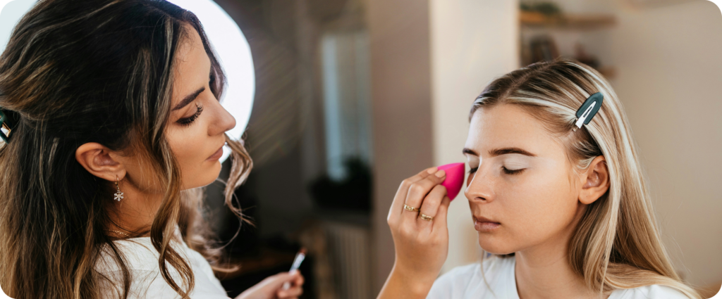Make-up artist applying make-up with a sponge